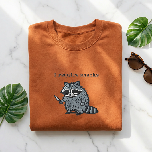 I Require Snacks Embroidered Raccoon Sweatshirt